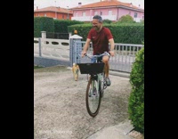 Dog follows man riding bike in circles