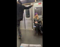 Man dancing and doing stunts inside the subway 
