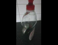 Bubble floats inside dish soap bottle 