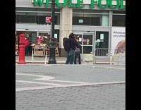 Guy blows into horn instrument whole foods 