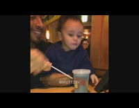 Baby boy eats lemon  from water cup, spits it out and makes disgusted face