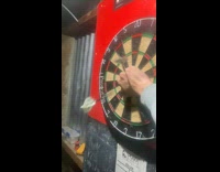 Guy puts fist on dartboard gets hit fail 