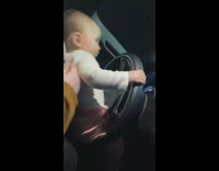 baby thrusts at steering wheel honks horn