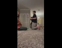 Black dog jump and push purple balloon