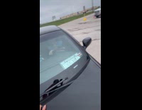 Woman pink pajamas ride on car hood