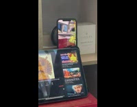 Overseas family attend funeral through phone statue