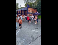 Collab IITW - Man red shirt dances middle of walkway