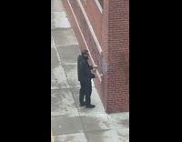 Guy scrubs graffiti off wall toilet pt. 2