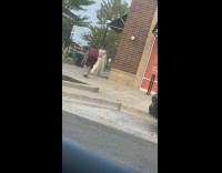 Collab IITW - Woman in white dress walks on sidewalk