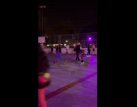 Woman Supergirl costume skate dance at rink