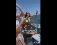 Girl on boat gives number to coast guard