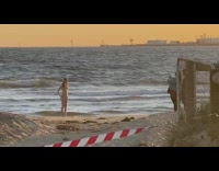 Woman interpretative dance beach red white tape