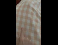 Grey cat plays underneath blanket 