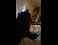 Dog on bed tries to bite camera