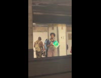 Man plays toilet paper waiting for train