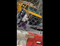 Yellow van stuck on metal pole