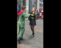 People in costumes walk around 