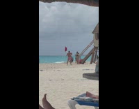 Guy Poses as a Lifeguard with Floatie on Sand 