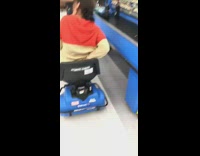 Woman scooter walmart check out line
