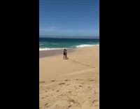 Couple hug and kiss on beach tripod