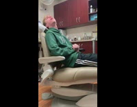 Guy green hoodie sweater fakes seizure scares dentist assistant