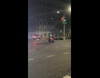 Panda mascot costume rides blue scooter street