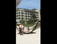 Girl bikini lay pose beach swing buildings