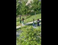 Girls dance on street phone on trashcan
