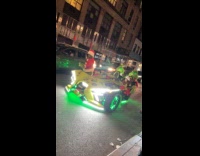 Grinch on slingshot car run towards pizza