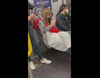  Man in Godly apostle apparel sits on subway