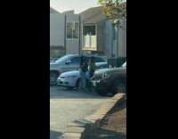 Two girls film tiktok in parking lot