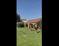 Group playing badminton guy hits stomach to make noise