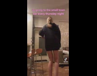 Friends jump and dance towards front door in a line 