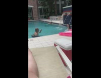 Bald guy girl blue water fountain pool 