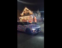 House and car with christmas lights street night