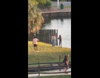 Three people floral top park dance video