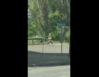Woman yellow tank top alone ballerina dance empty parking lot