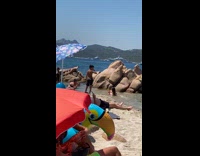 Woman bikini lay down sideways beach pictorial