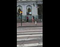 Woman red jacket hand on head street