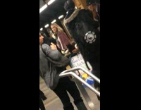Man has a dog, birds, and a cat inside subway station