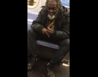 Old man spits in his palm and rubs his hands together on subway