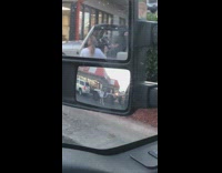 Woman white shirt tiktok dance parking lot side mirror
