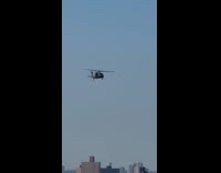 Helicopter fly and pass by the city