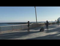 Woman black backless dress dance beach railings part 2