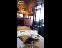 Collab Kale Salad IG - Guy sits alone at table covid restrictions