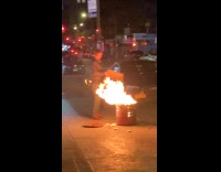 Collab winy - Woman burn trash on street at night