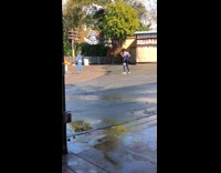Girl dances in front of pirate ride legoland
