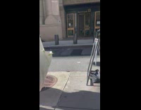 Astronaut runs down street while guy in car films 