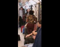 Woman dances salsa with mannequin man on subway train
