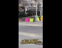 woman dancing with bright signs around her